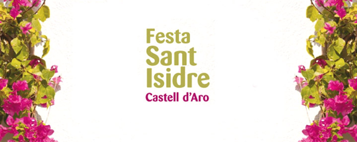 Rètol de la Festa de Sant Isidre emmarcat per flors.